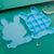Clear plastic storage box with cartoon bear design.