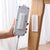 Self-adhesive wall mount plug organizer