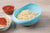 Large plastic rice bowl strainer, ideal for washing and storing grains.